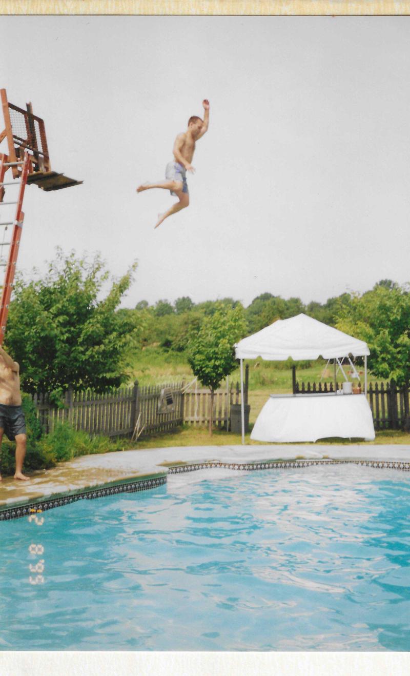 Jumping off the Lull a huge forklift into the pool